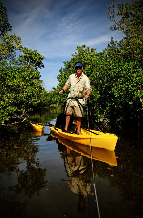 bigstock-Handsome-Man-Kayaking-And-Fish-33191714