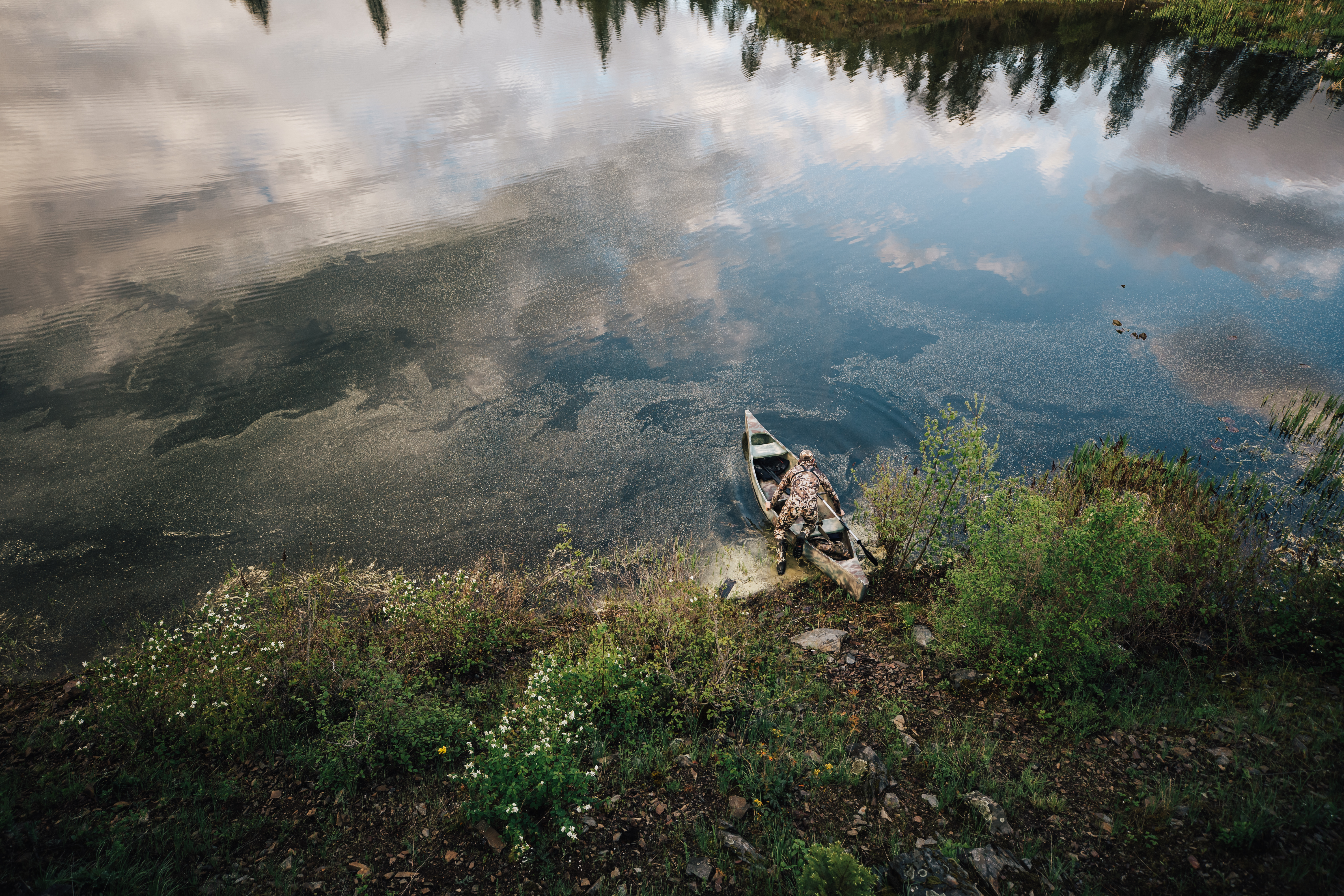 duck hunting with hunter on a boat