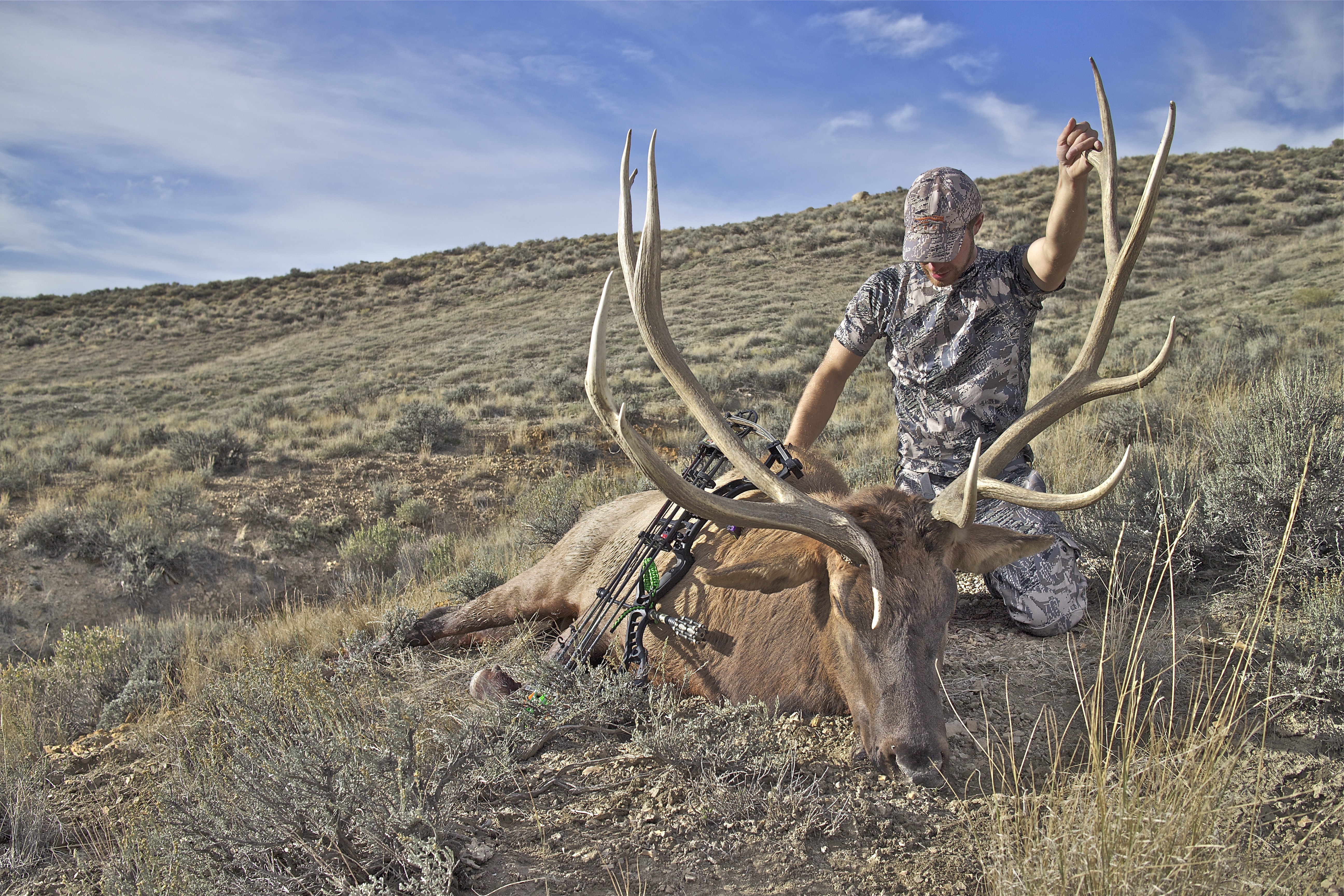 Hunter With A Elk