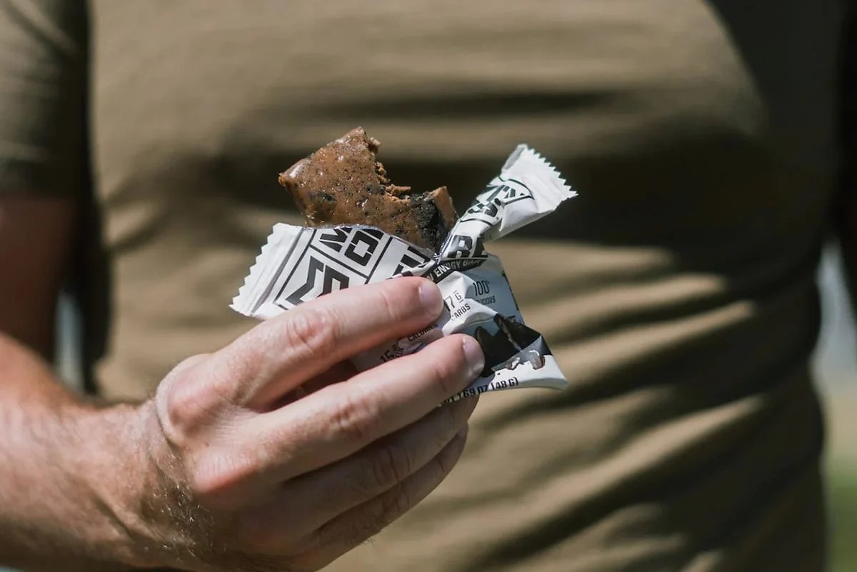 Mtn Ops bar in the hand about to be eaten.