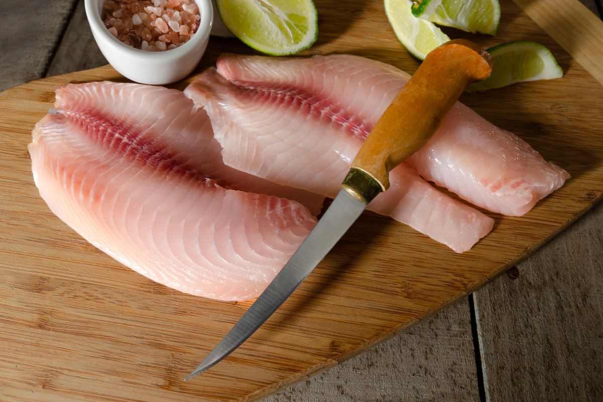 Fish fillet knives and fresh fish.