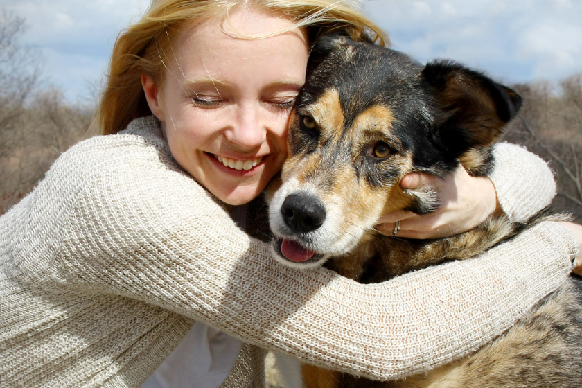 Girl hugging German shepherd