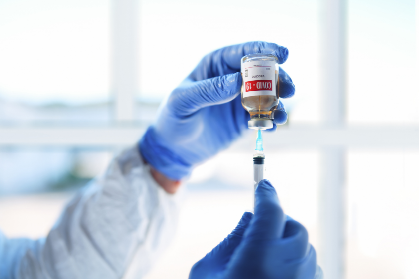 Vaccination dose is drawn from a bottle