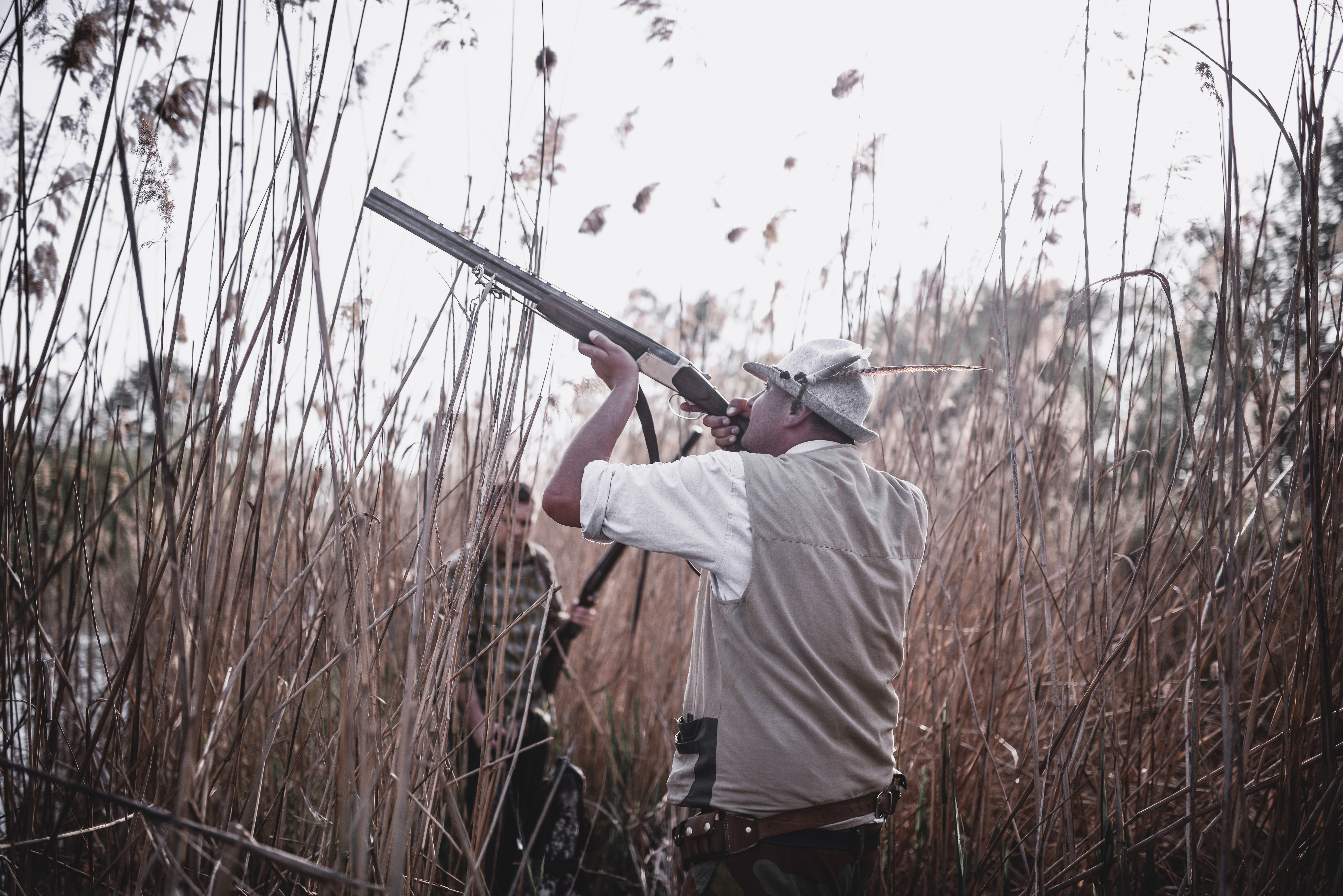 Group of Hunters Hidden in the Swamp and Preparing for Hunting 