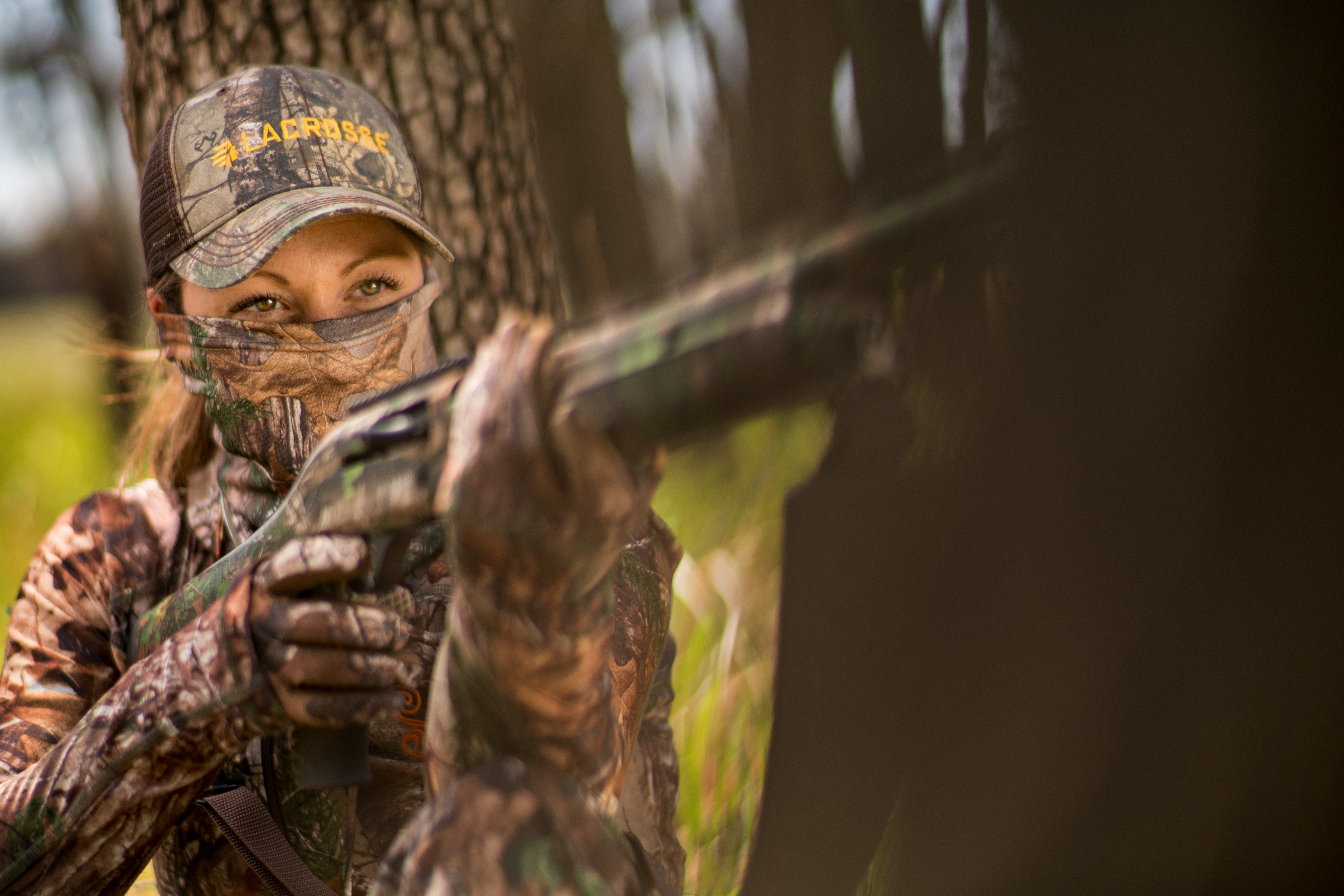 female hunter with a rifle