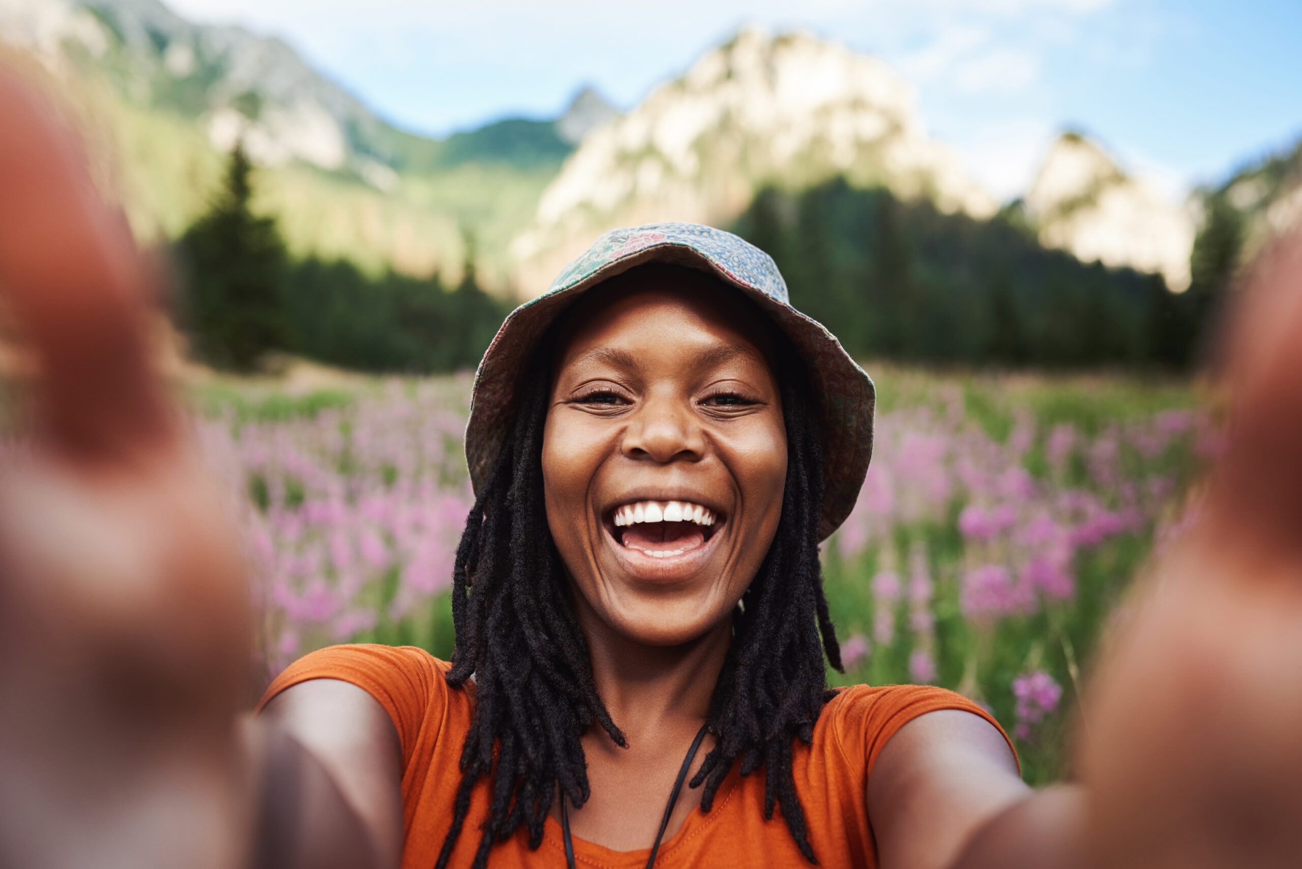 Cropped shot of an attractive young woman taking a selfie in a field of flowers in nature