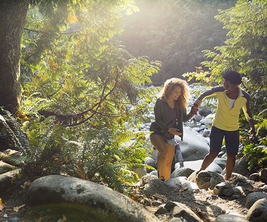 Two people hiking through a rocky trail