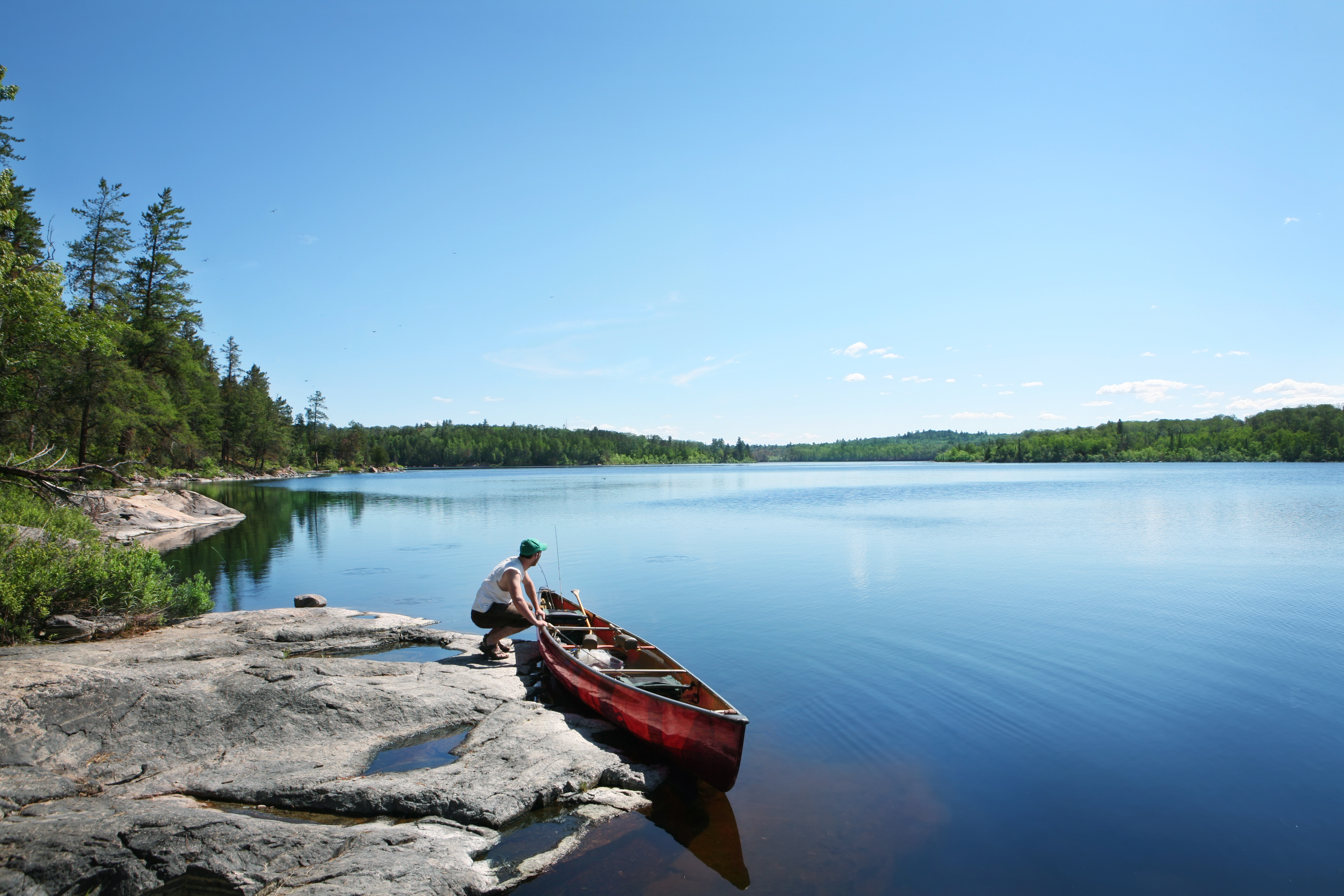 Getting ready to go fishing on a perfect summer morning. Classic Smallmouth Bass and Walleye water on Crooked Lake (Wednesday Bay) in the Boundary Waters Canoe Area / Quetico Provincial Park.