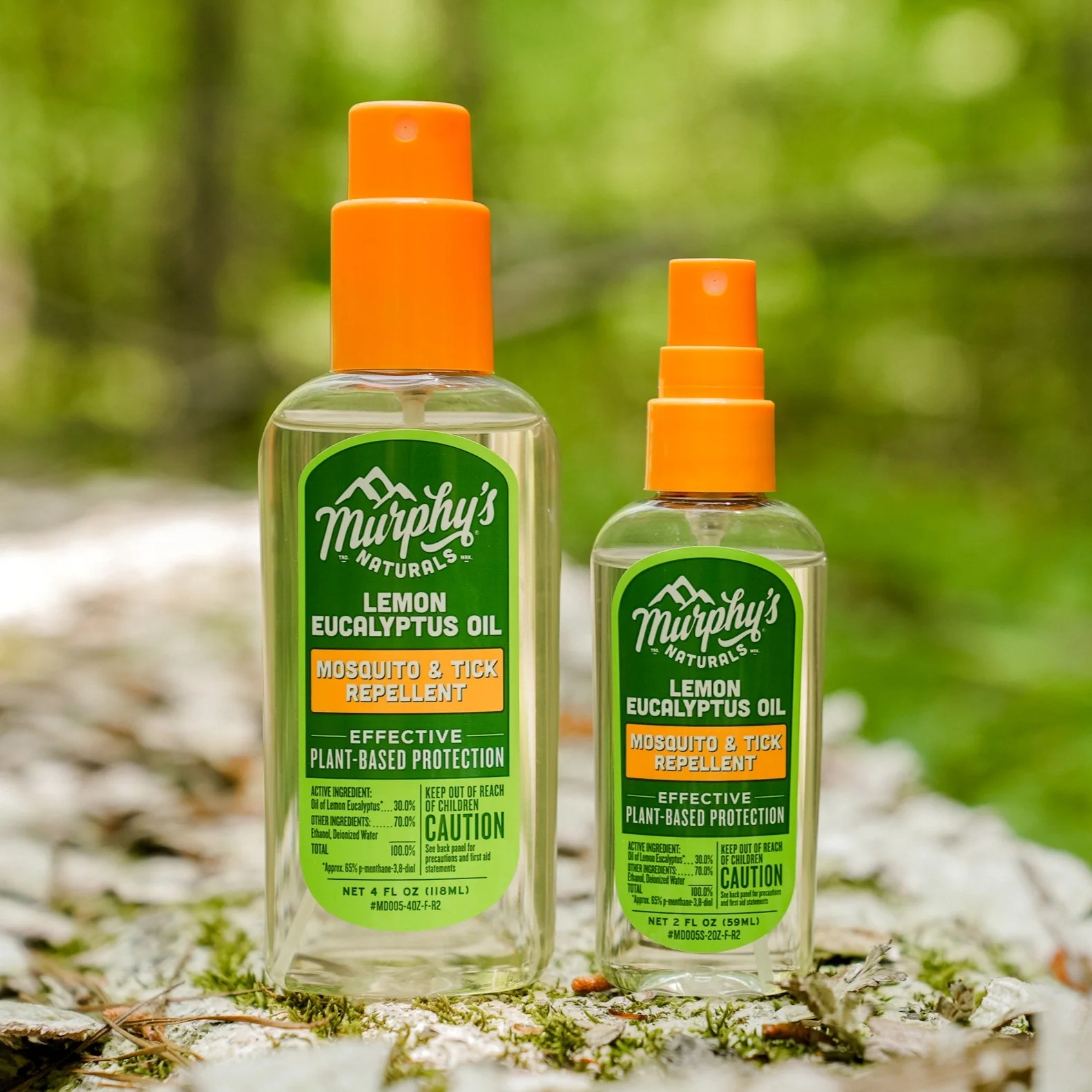 Two bottles of Murphy's Naturals Insect Repellent Spray on a campground