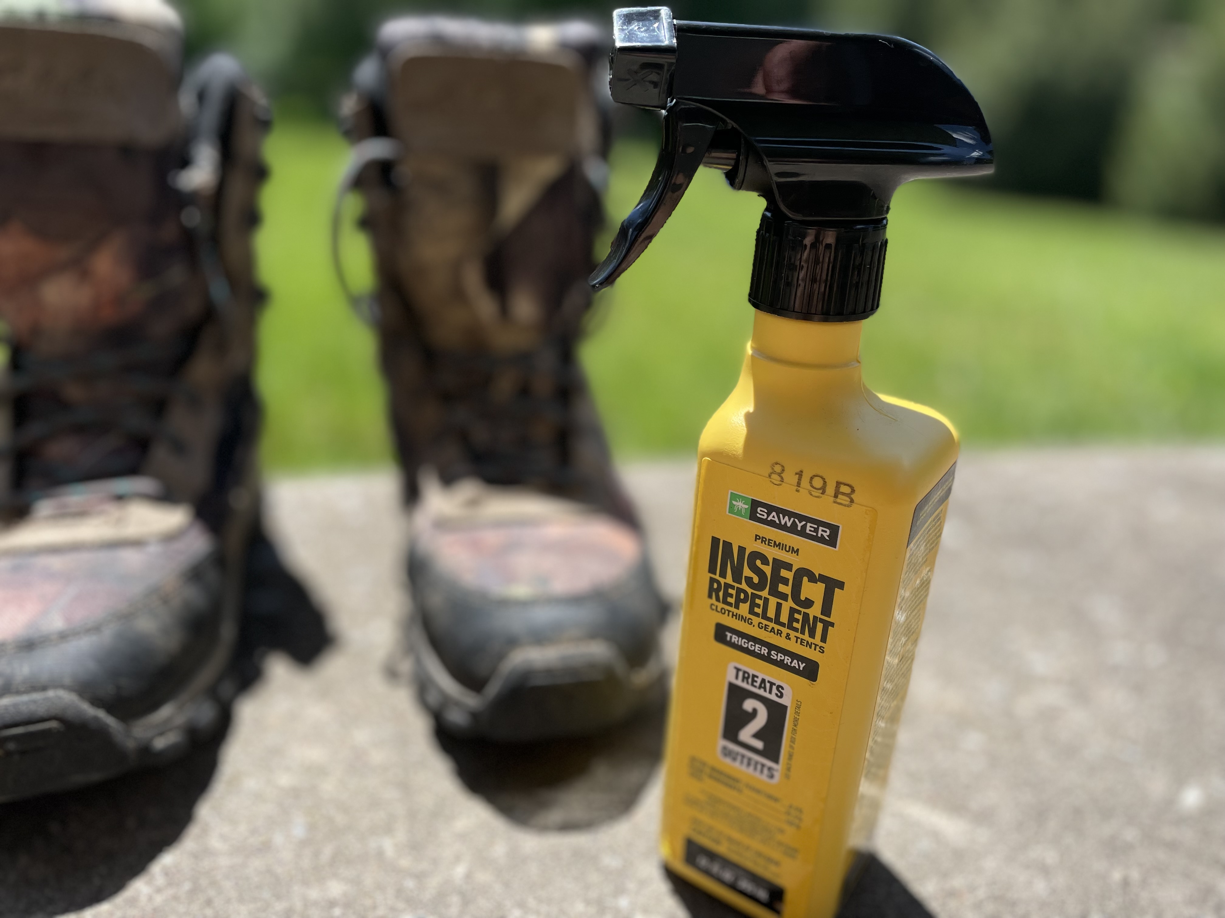 A yellow bottle of Sawyer Fabric Treatment