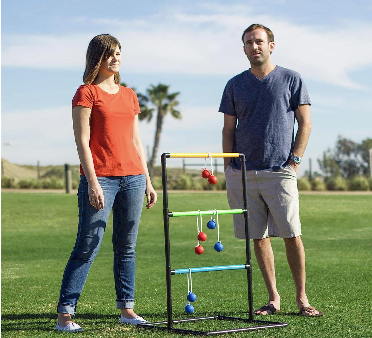 A couple playing ladder golf. 