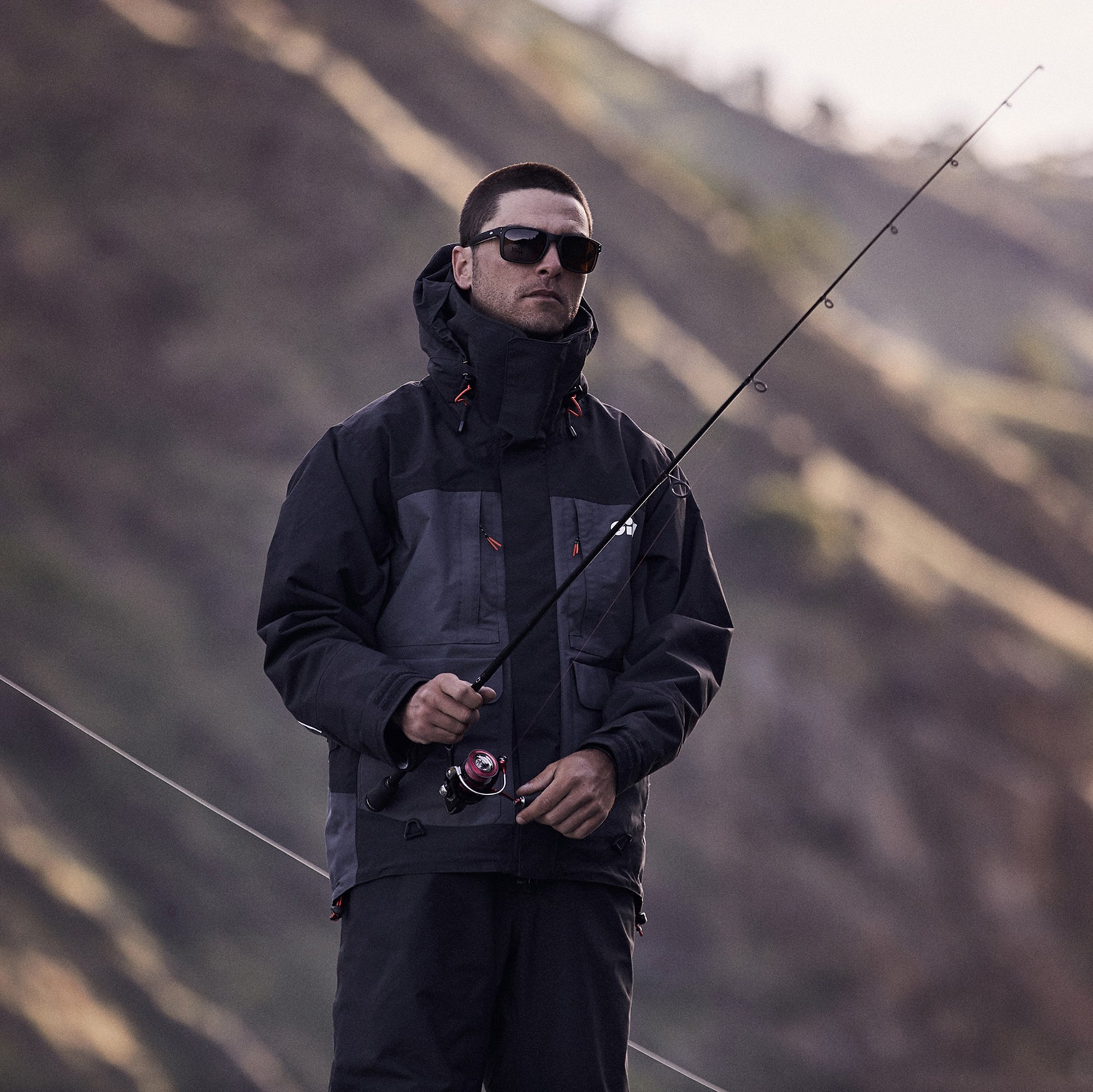 Person wearing the Gill Fishing Tournament Jacket while fishing 