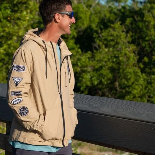 Person wearing tan Salt Life Rogue Jacket