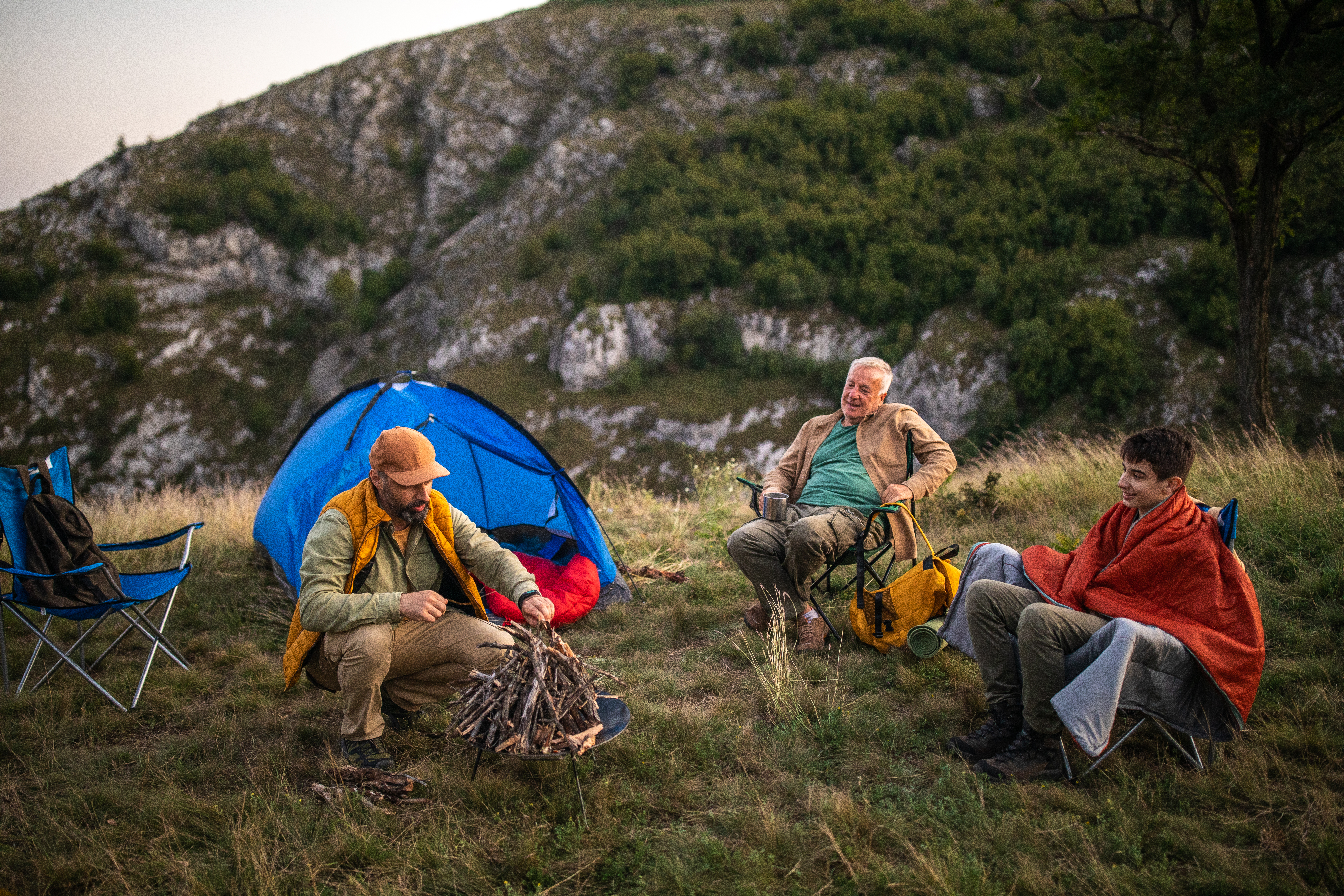 Multi-generation family having fun time together during camping