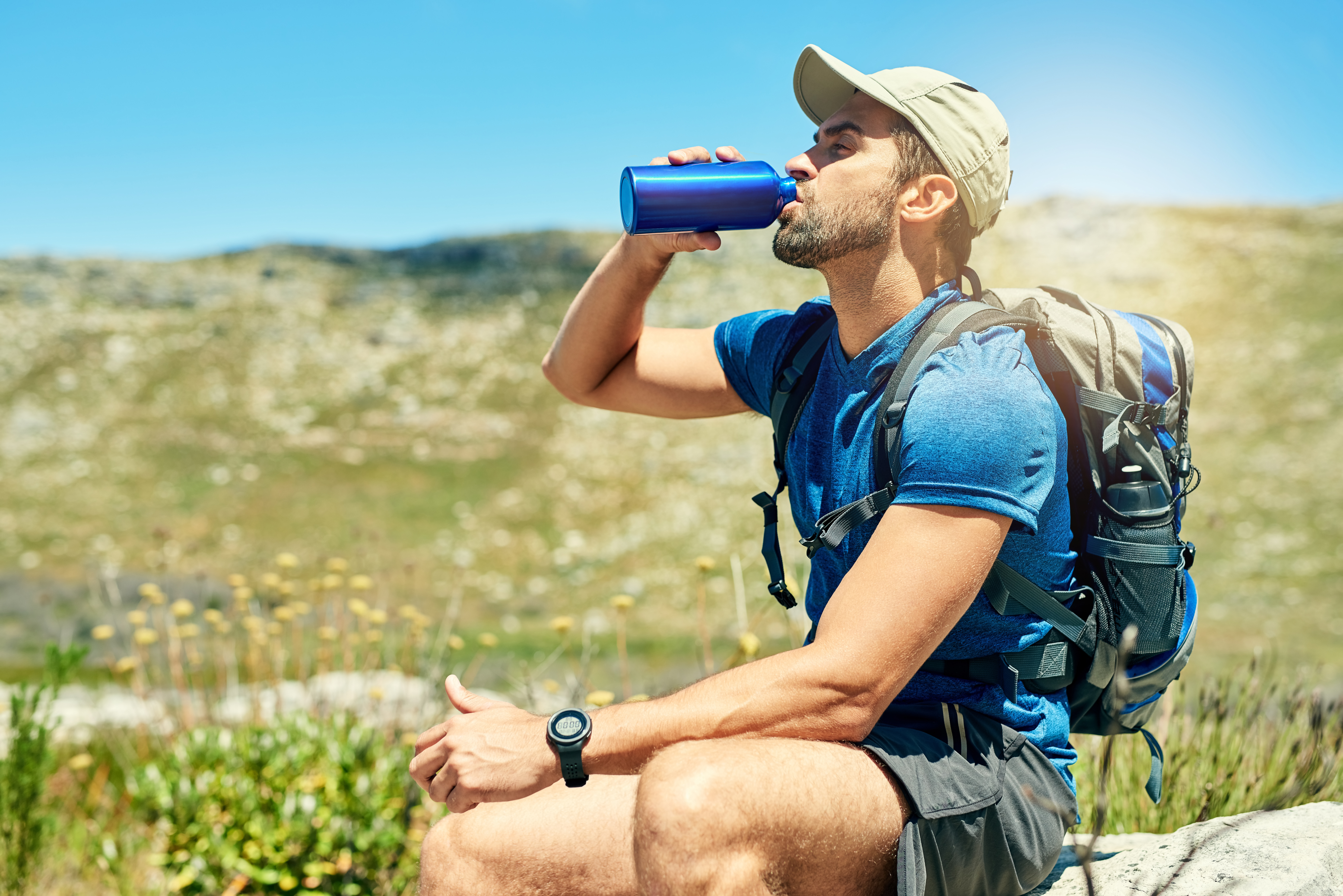 Cropped shot of a young man taking a break while out on a hike 