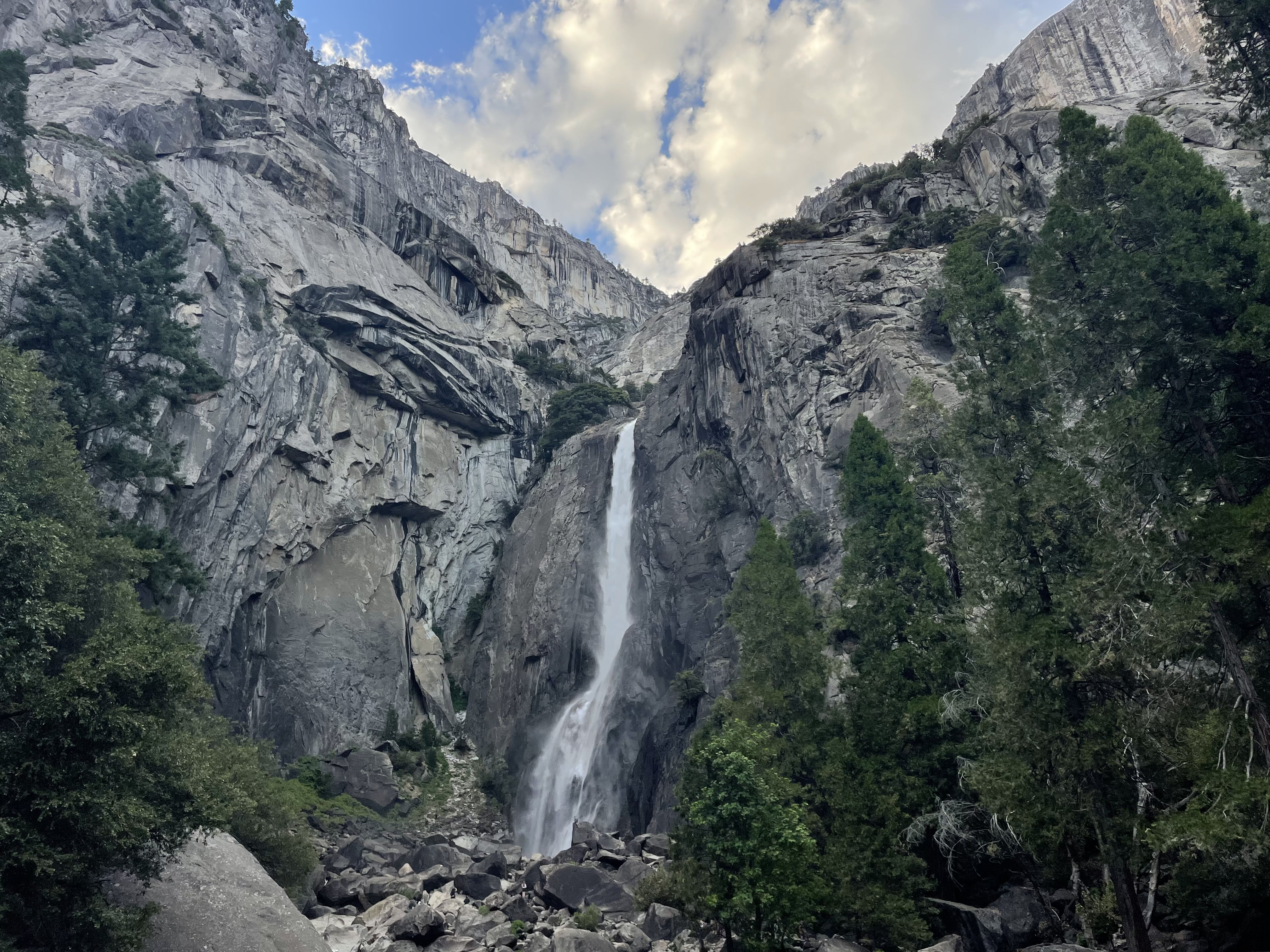 A mountain and waterfall view in Lower Yosemite Falls