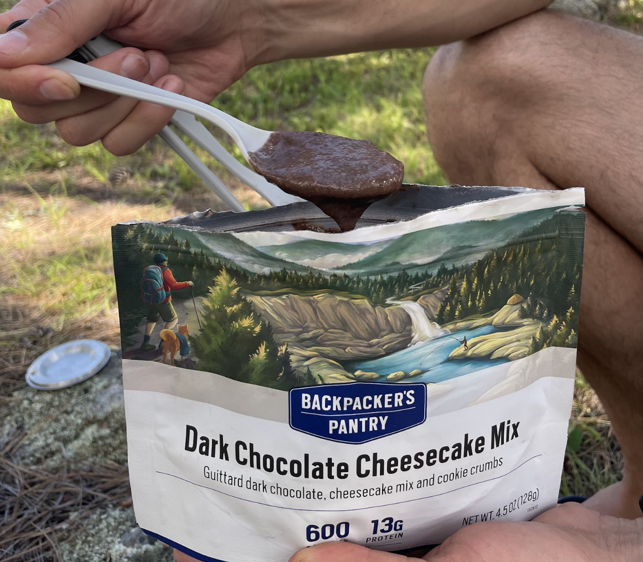 An open pouch of Backpacker's Pantry Dark Chocolate Cheesecake Mix