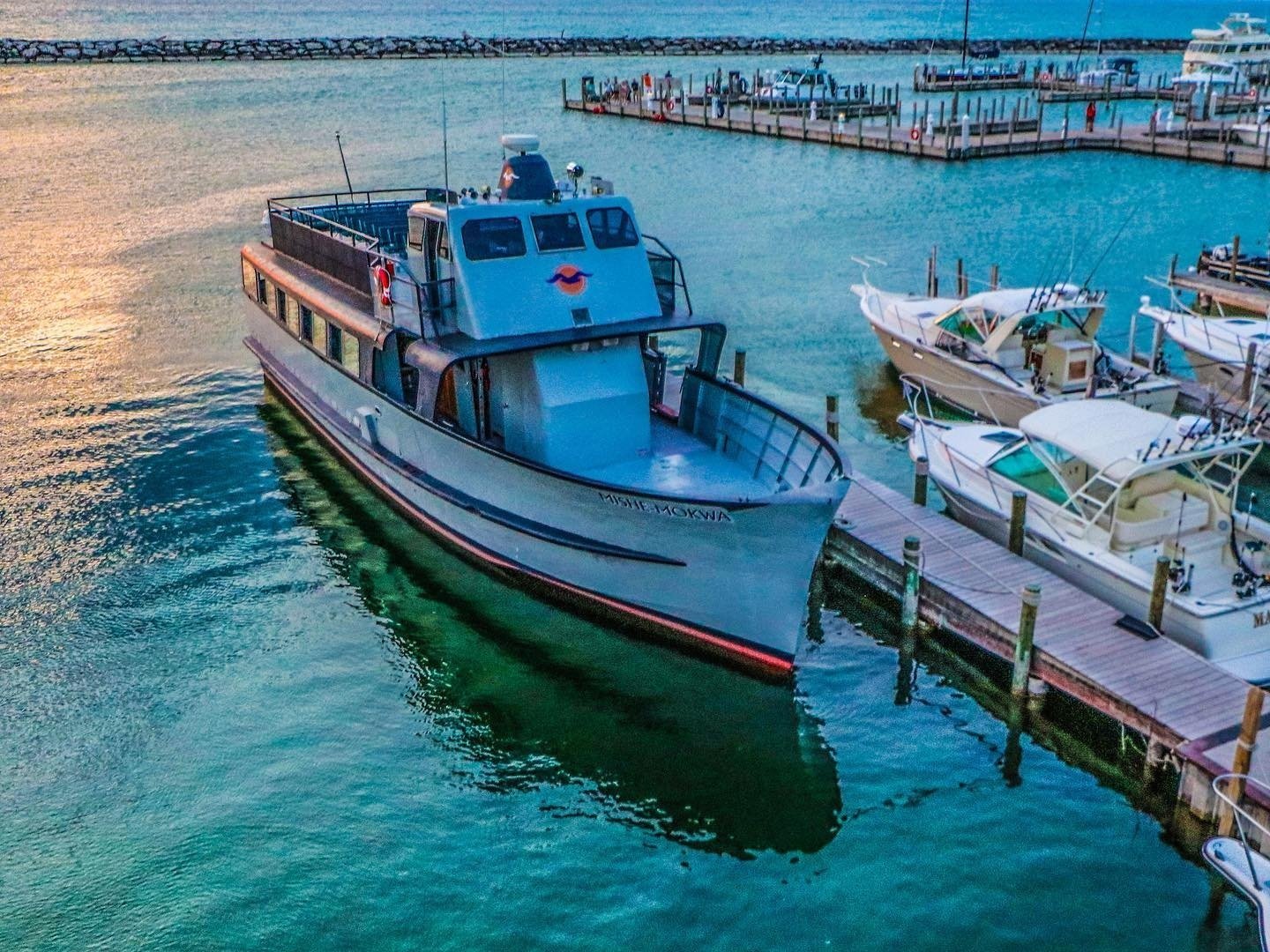 A boat that is docked, ready to transfer travelers to Manitou Island