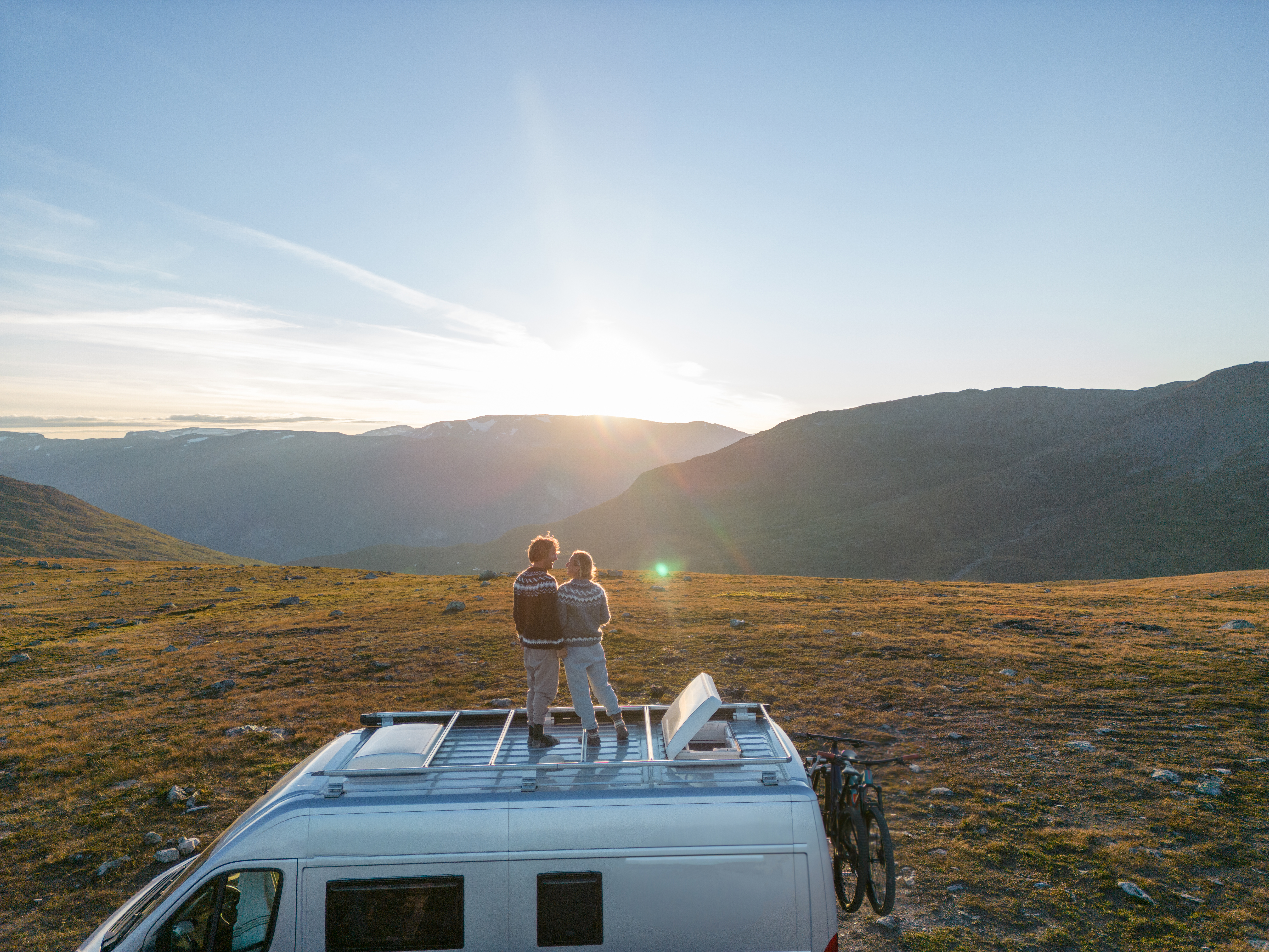 People travel, alternative homes concept. They enjoy the nature right outside a mobile home.