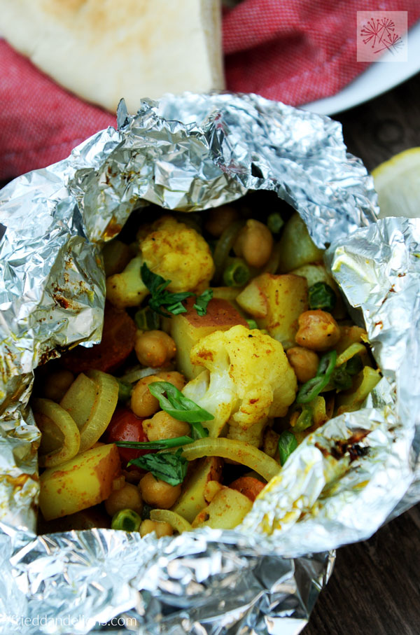 A cauliflower sautee inside a tin foil bowl