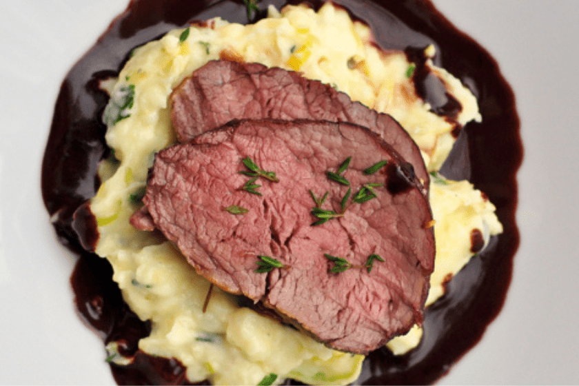 Maple Juniper Venison Loin with Chocolate Infused Red Wine Jus, Leek and Potato Mash.