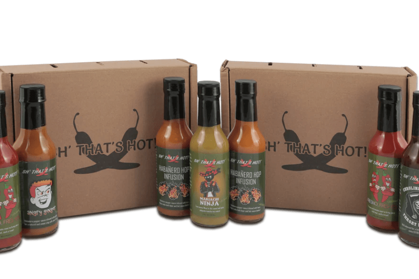 Several different bottles of Sh! That's Hot Hot Sauce