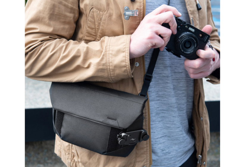 Person holding a black camera