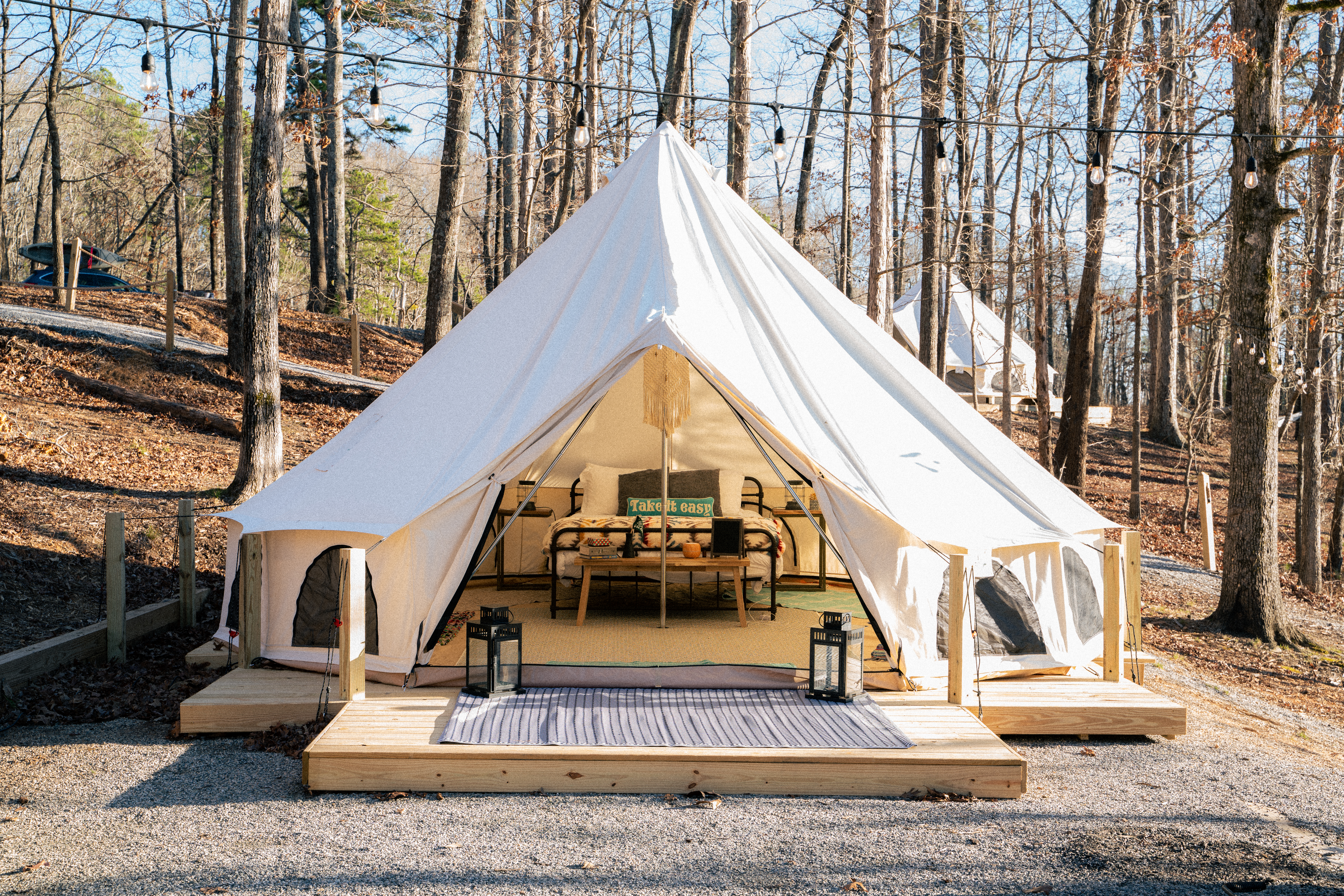 A large white tent set up for camping 