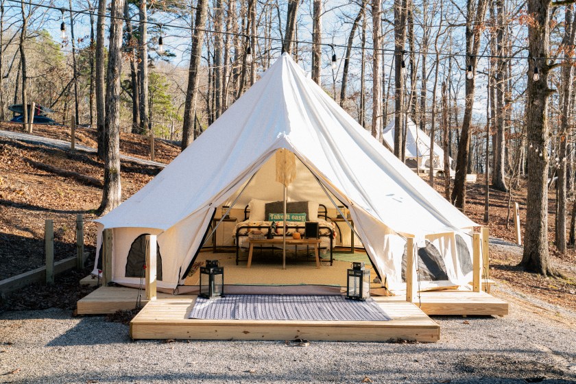 A large white tent set up for camping