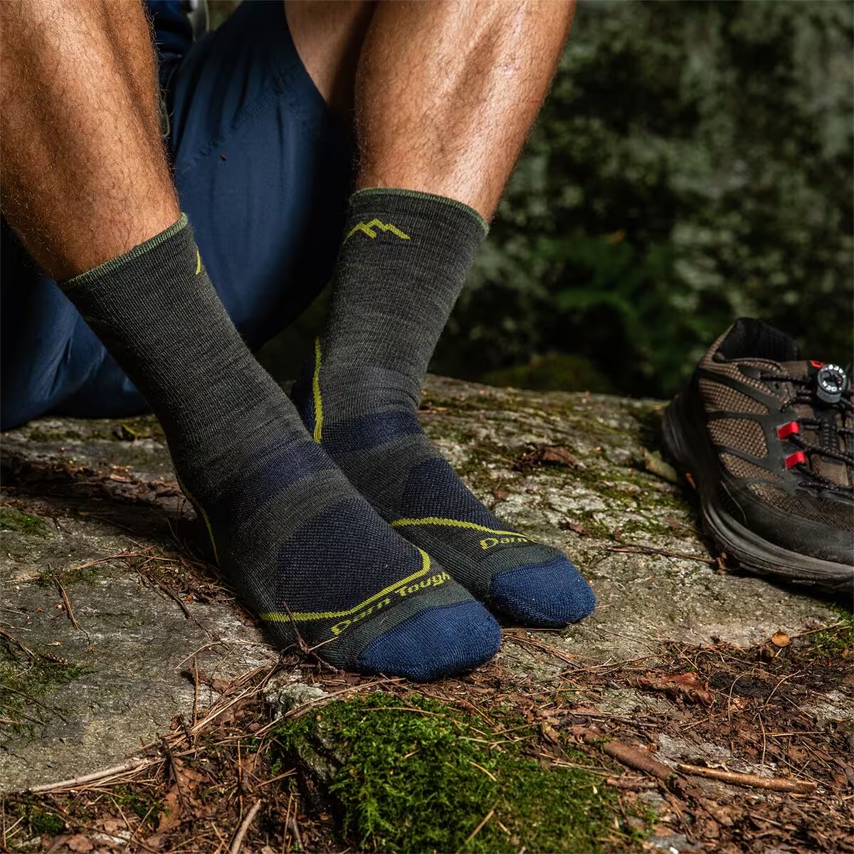 Person wearing gray darn tough socks with the photo zoomed in on their feet