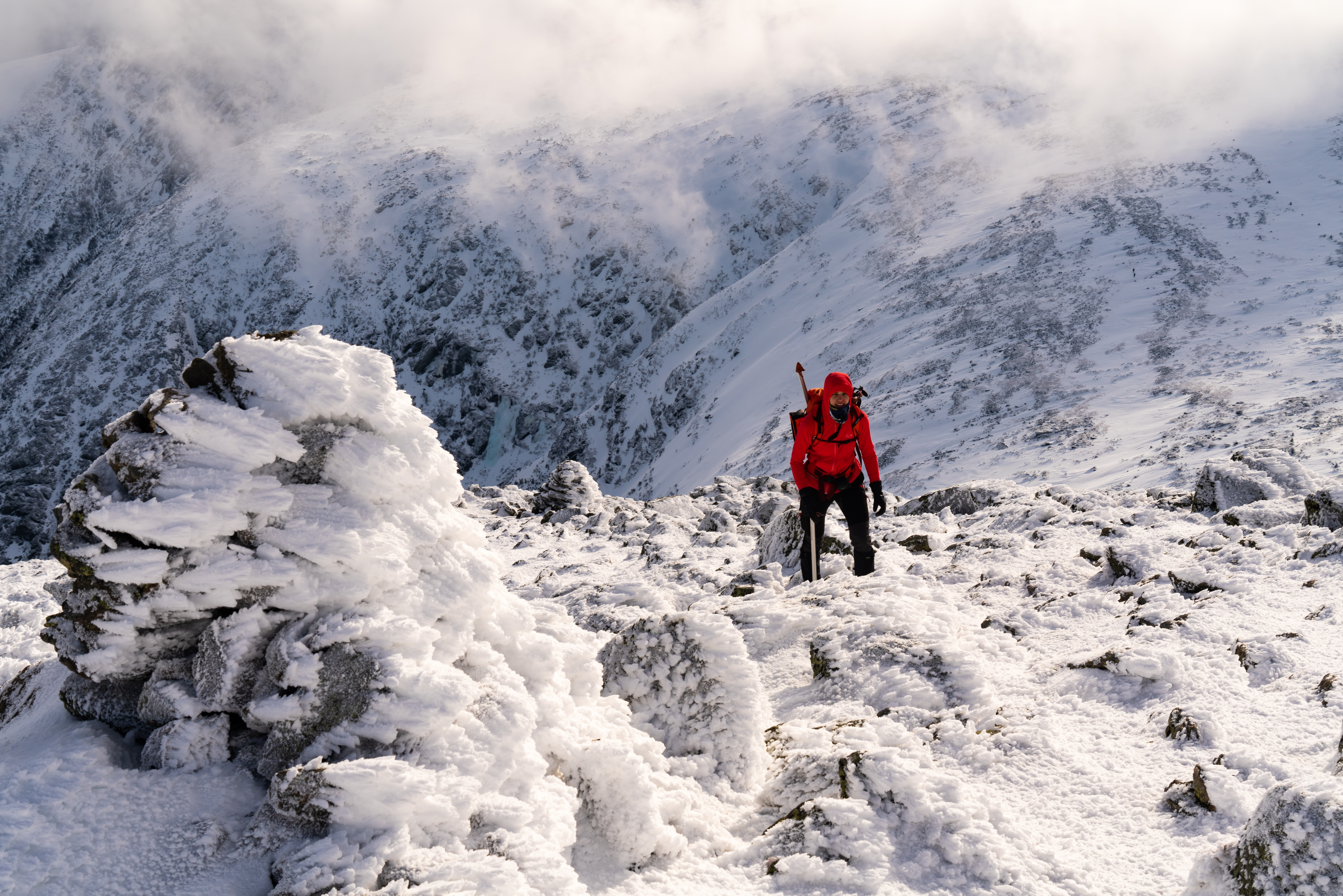This photo was taken on new years eve during a winter climb of Mt. Washington NH. The model Elizabeth Moats was just below the summit in the alpine garden. The sunlight and clouds were beautiful.