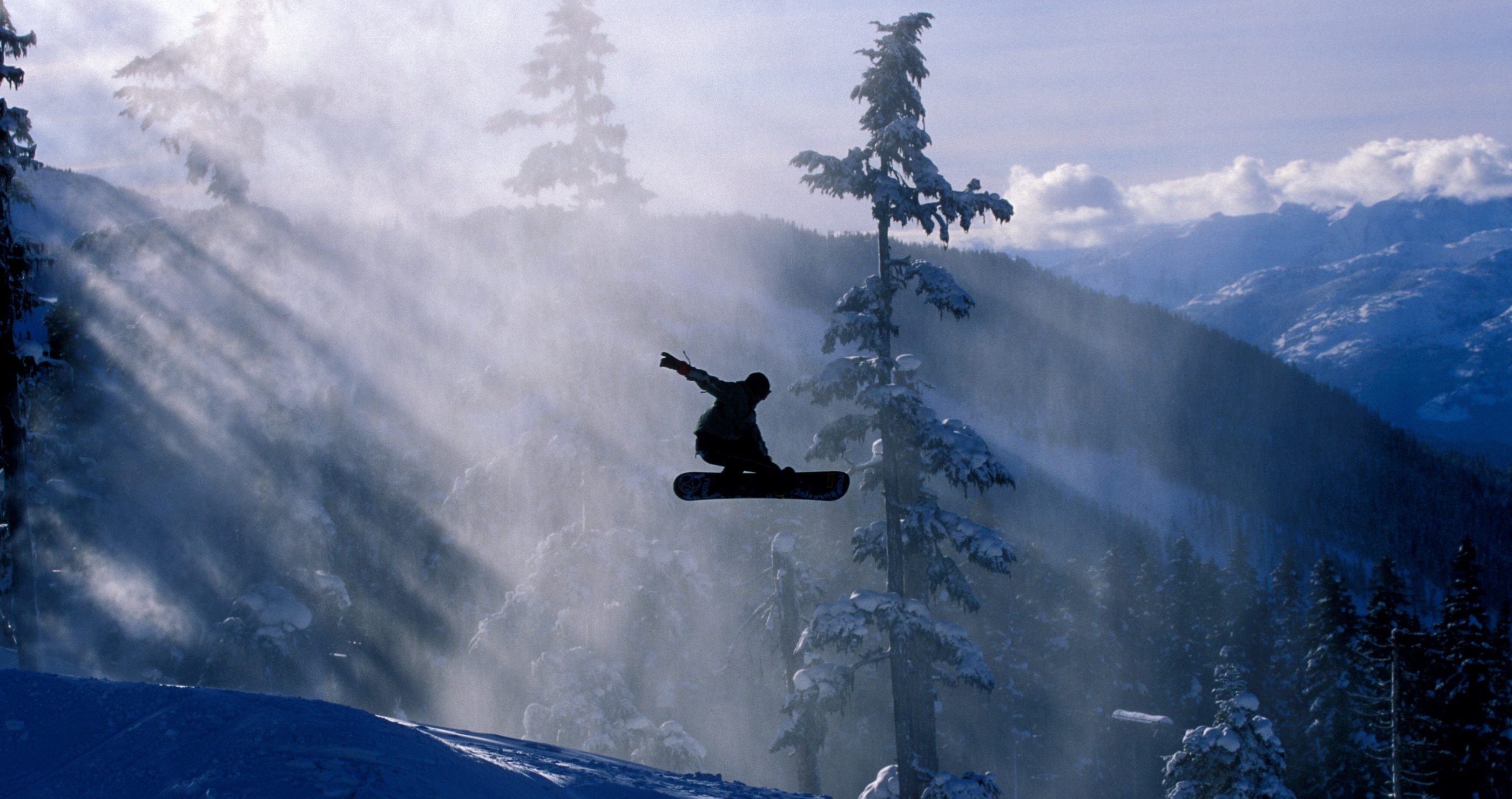 snowboarder wipes out hitting a black bear