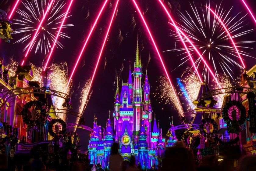 Image of Magic Kingdom Main street at night with fireworks