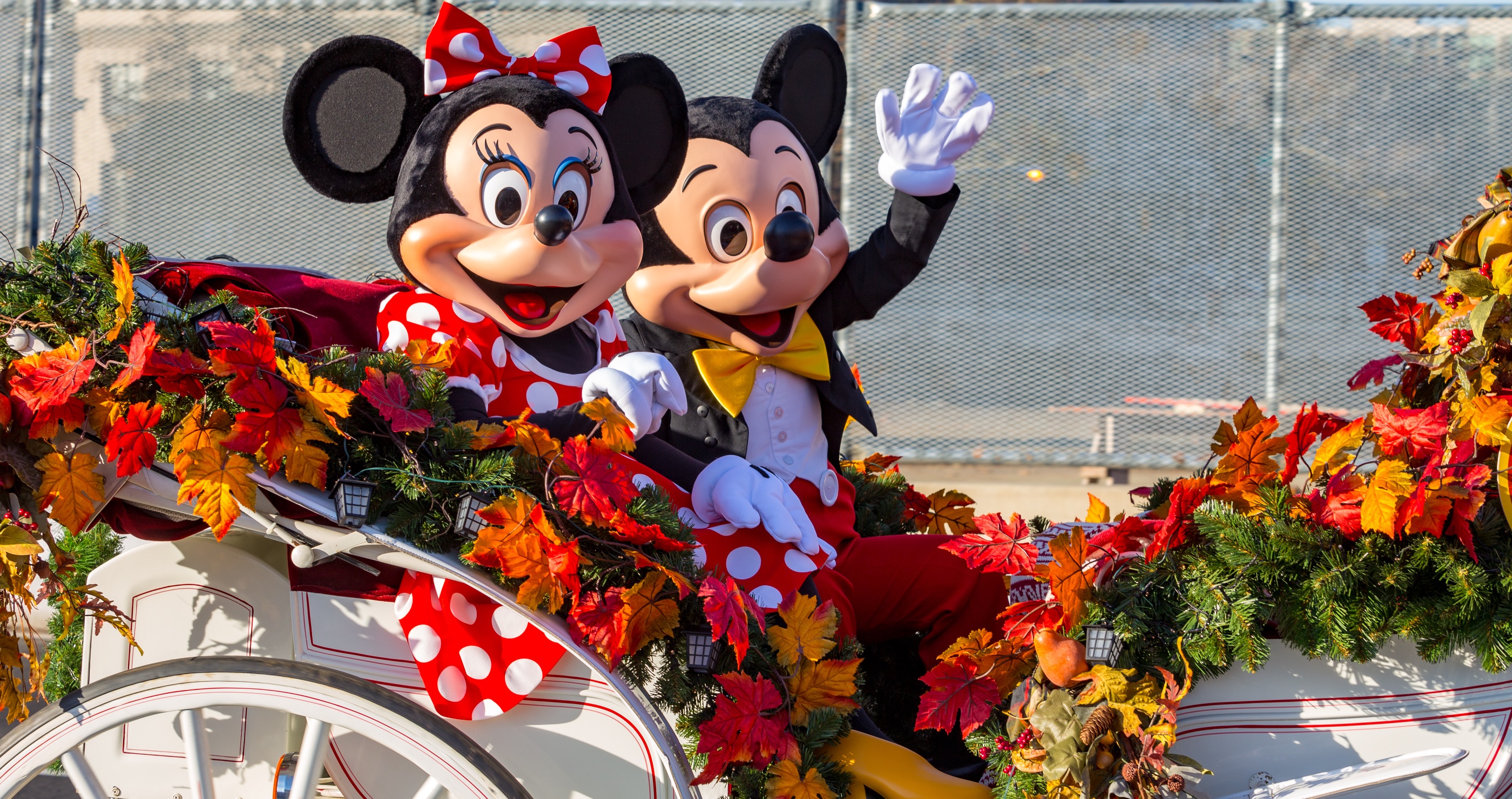 Mickey and Minnie mouse in a carriage