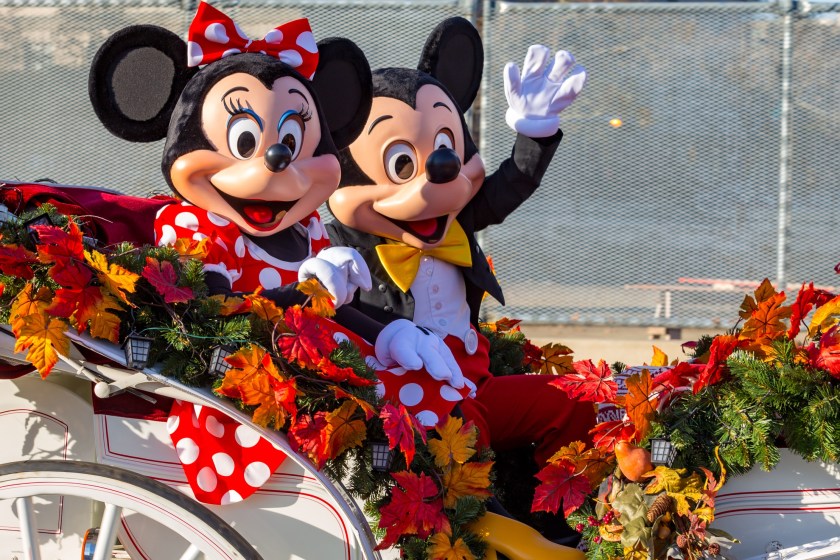 Mickey and Minnie mouse in a carriage