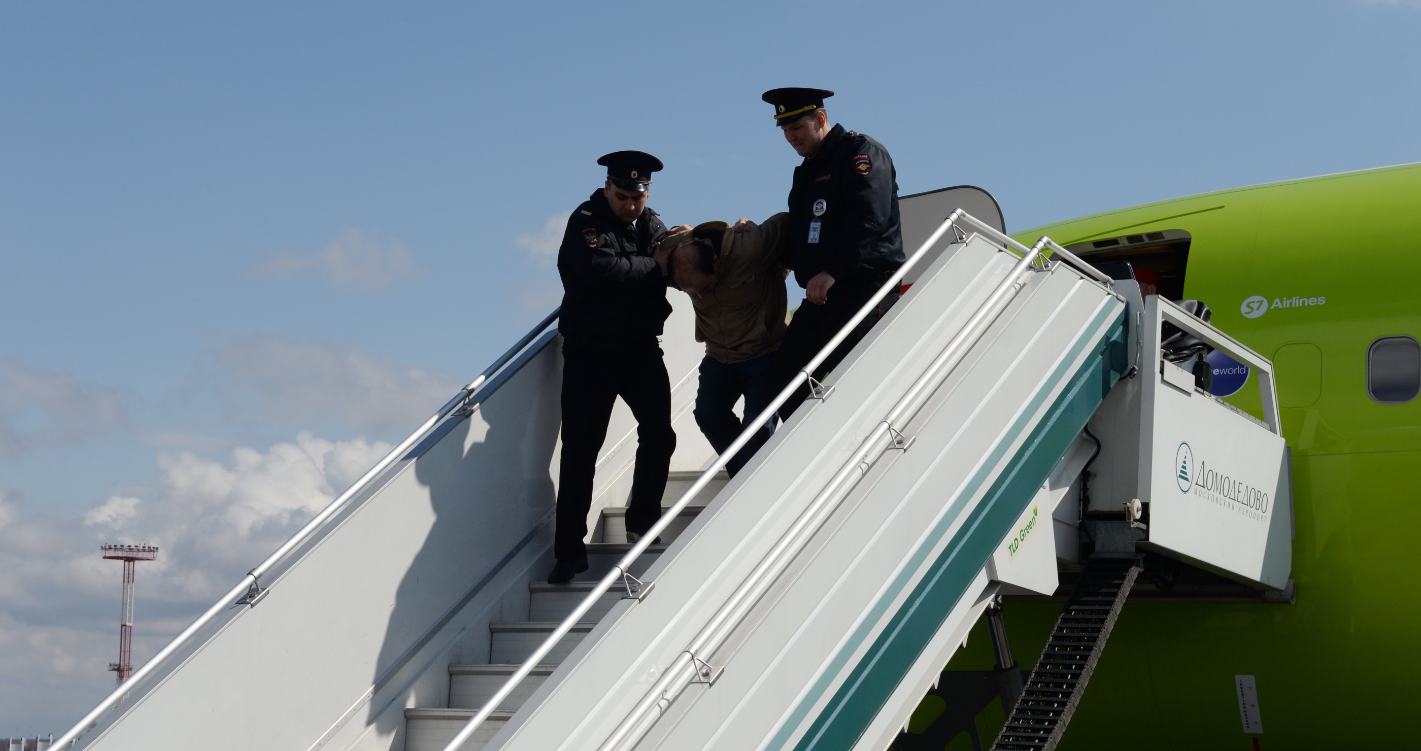 Passenger Tries To Open Plane Door During Flight